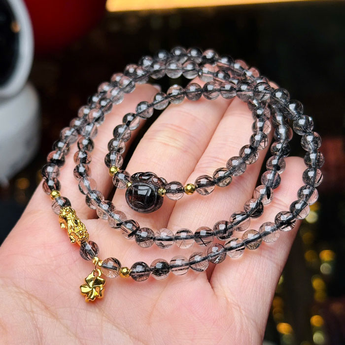 Vòng Đá Thạch Anh Tóc Đen 6,2li Mix Charm Vàng 18k
